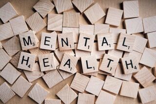 Scrabble letters spelling out mental health